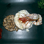 Gamberi freschi e baccalà sui fagioli